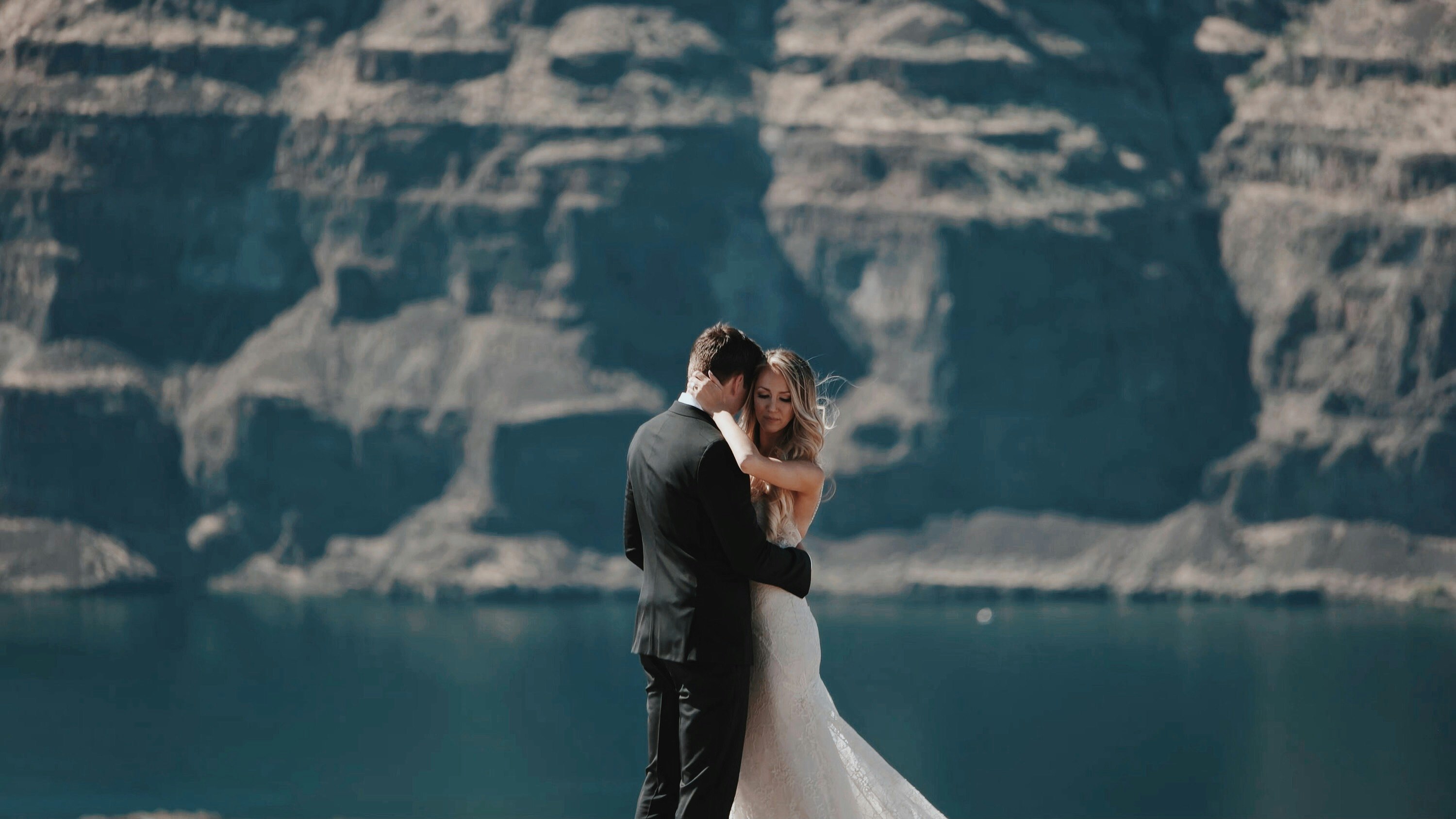 bride and groom hugging